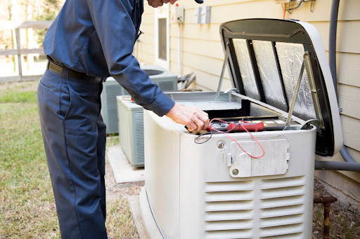 tech repairing generator